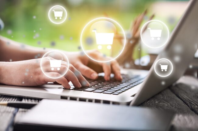Laptop with eCommerce shopping cart network.