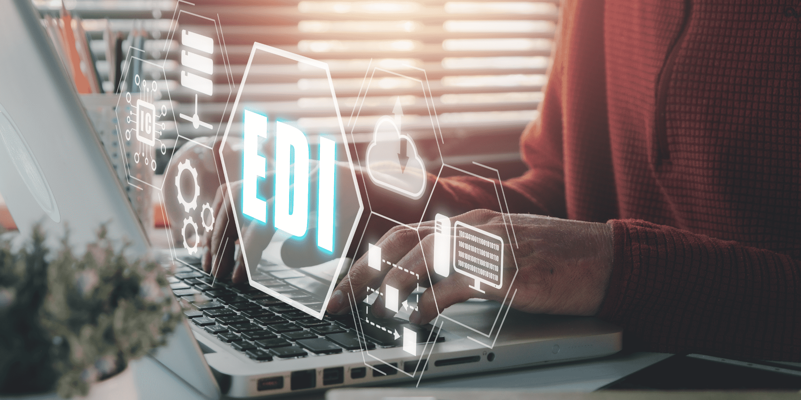 person working on computer with EDI graphic