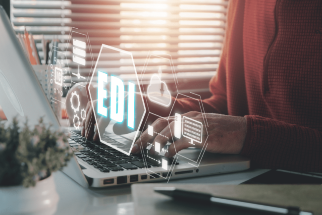 person working on computer with EDI graphic